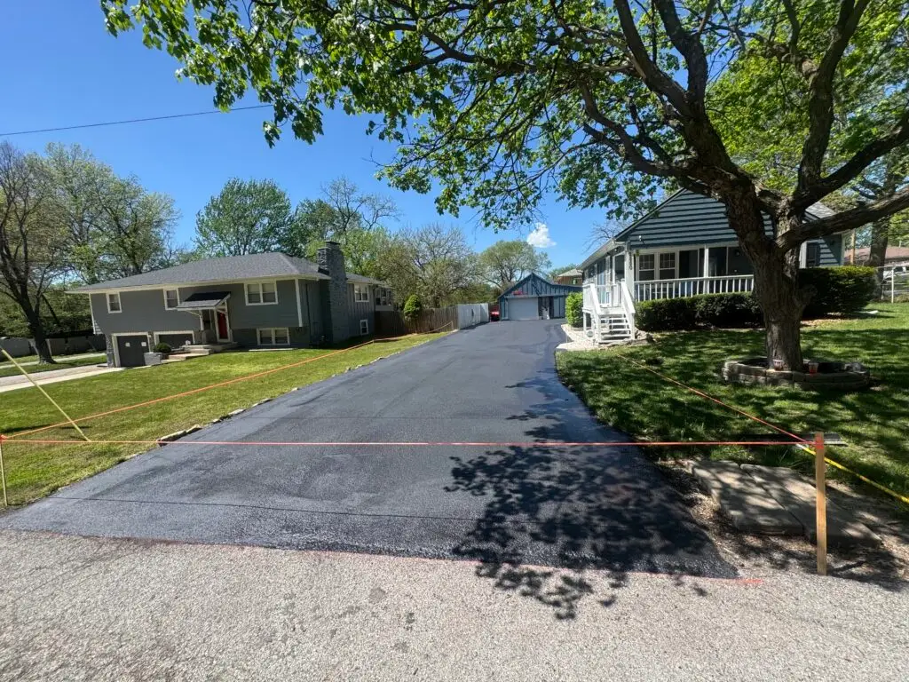 Professional asphalt sealcoating services in Kansas City and Johnson County, KS. Protect your driveway from harsh local weather conditions while enhancing its appearance with our high-quality, long-lasting sealant. Call RCS Seal and Paving Solutions today to extend the life of your pavement.